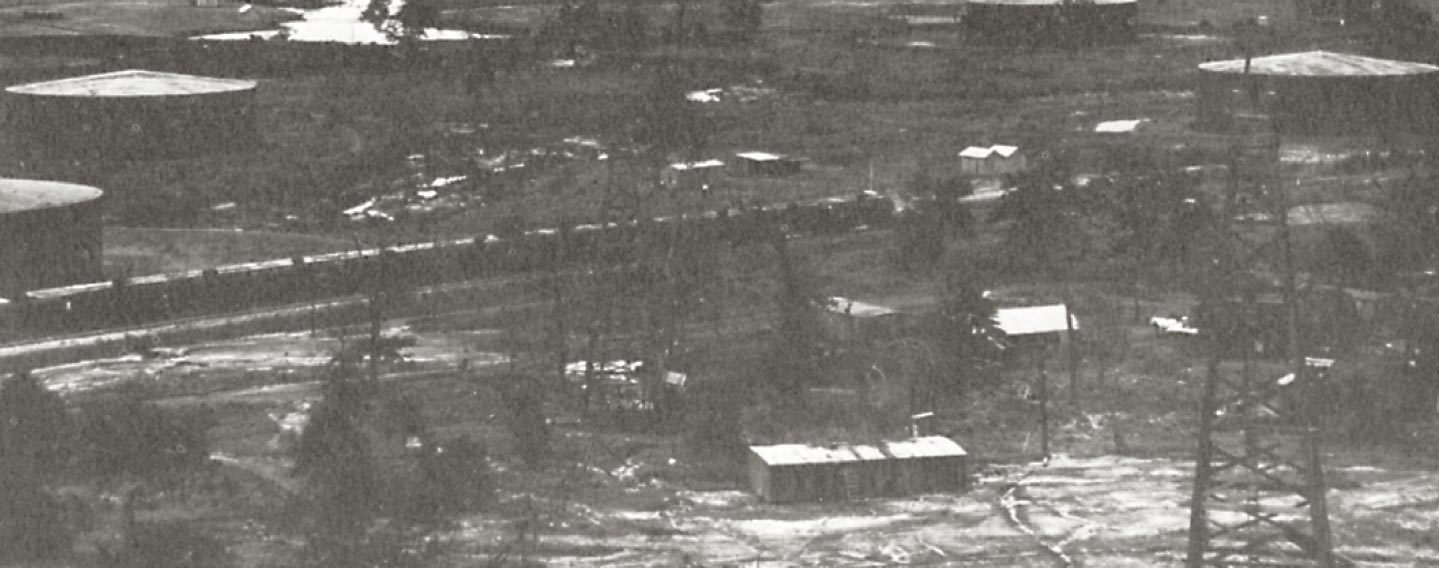 black and white photo of an oil camp