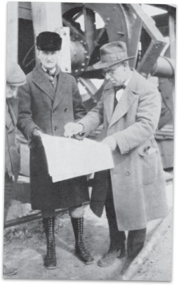 Two men looking over blueprints