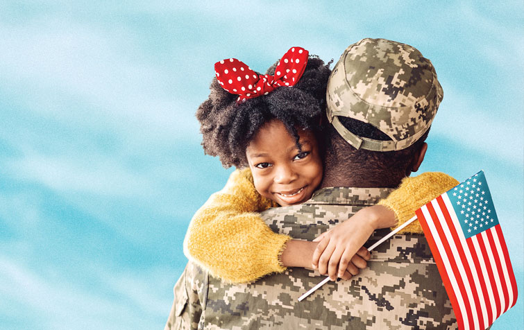 Soldier holding daughter