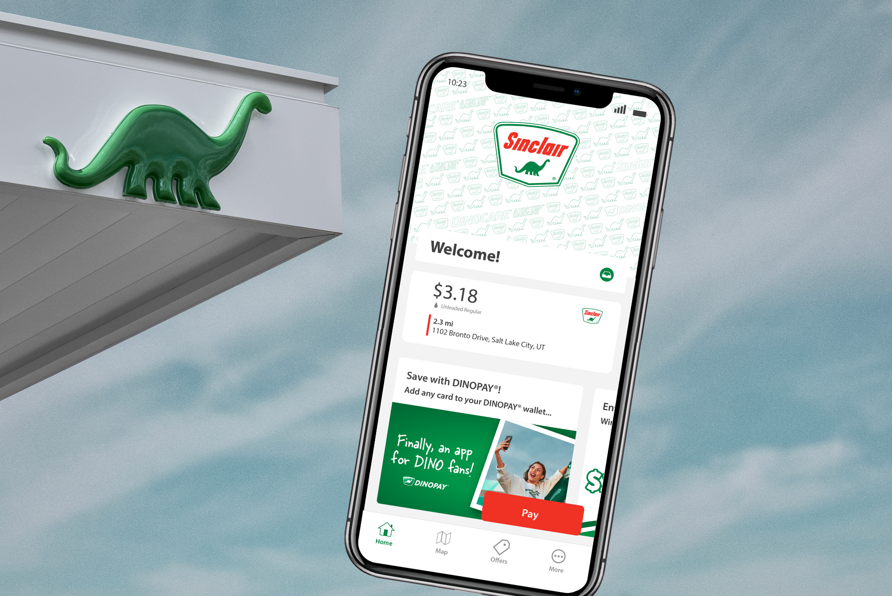 DINOPAY app on iPhone with Sinclair station in background