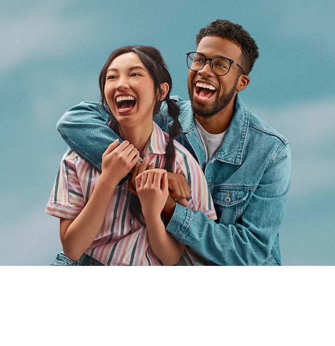 Couple hugging with sky background behind them