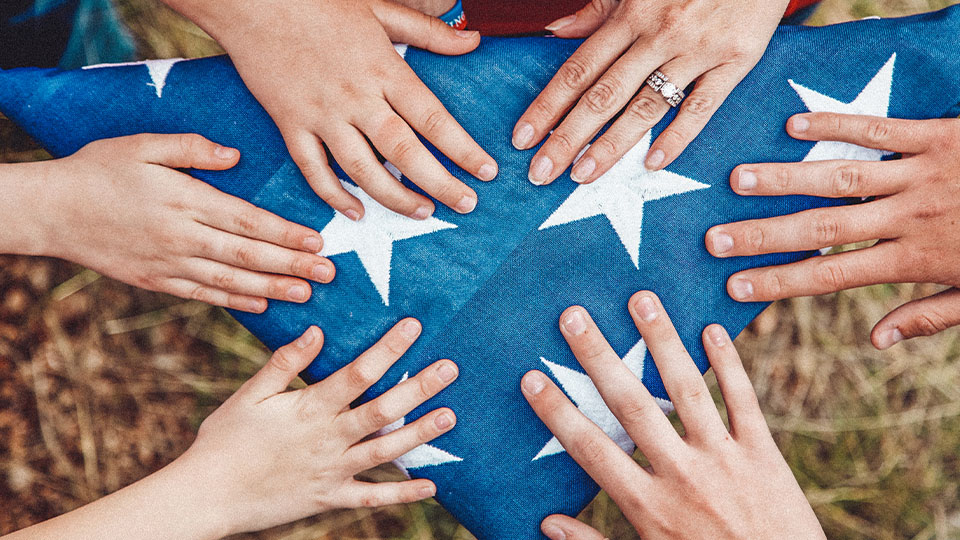 Folds of Honor - hands on flag